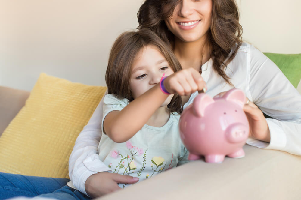 mother teaching child to save